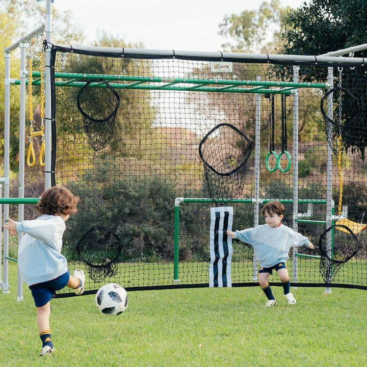 Kids playing football/soccer on Funky Monkey Bars backyard playground.