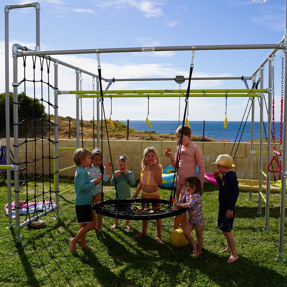 Children around black Large Nest Swing on a Funky Monkey Bars backyard frame