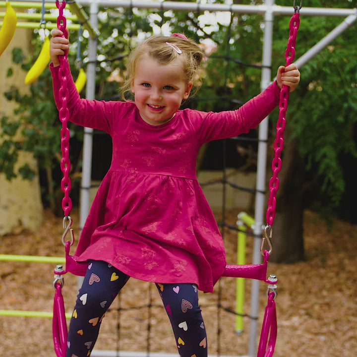 Video - child playing with red trapeze